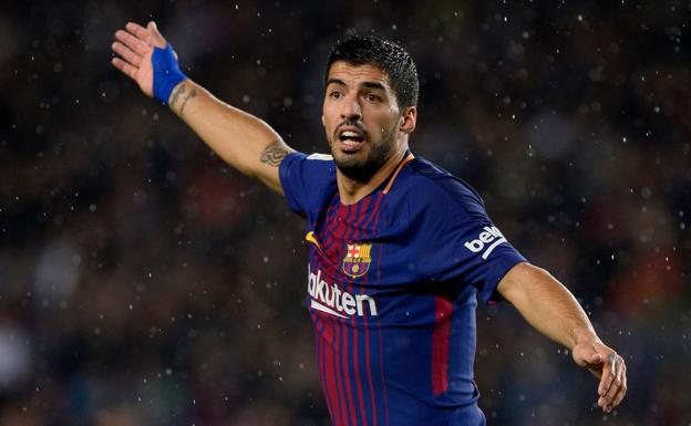 Luis Suárez, durante el partido ante el Sevilla. /Afp