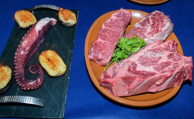 Pulpo y carne en un resturante de platos contundentes. /Torcuato Fandila.